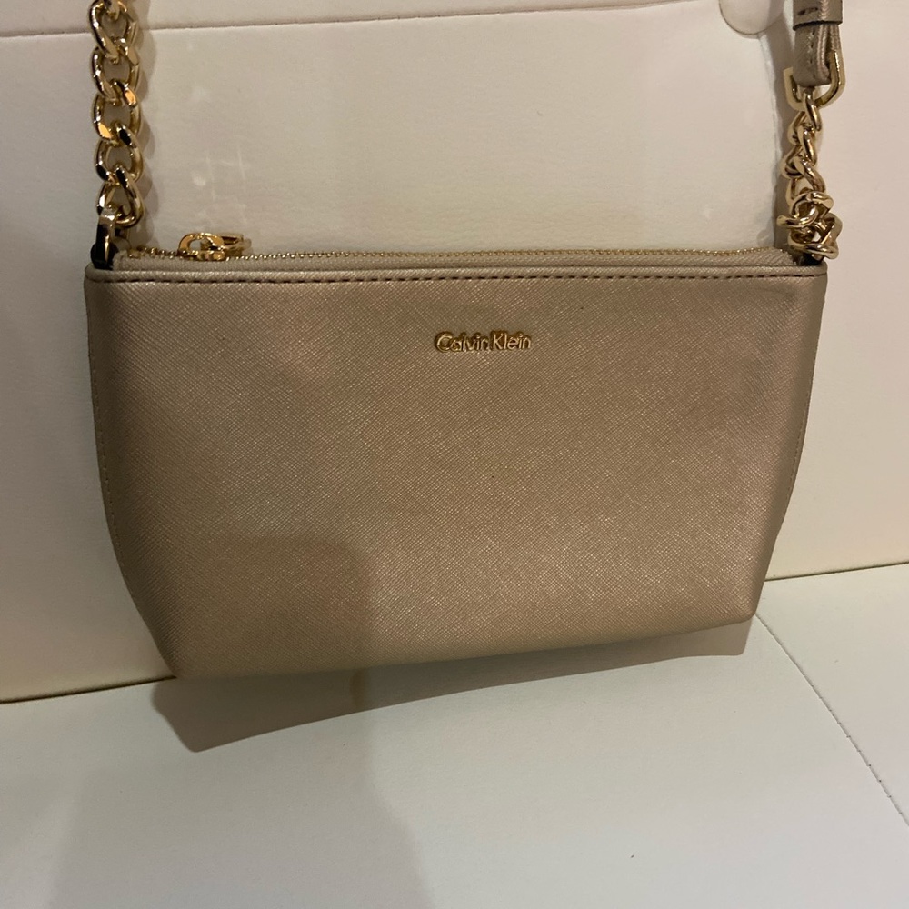 Calvin Klein gold shimmer cross body bag gold accents zipper closure
